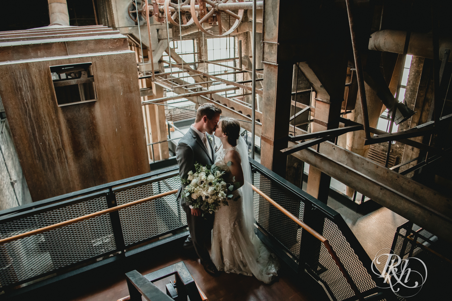 bride and groom in industrial setting