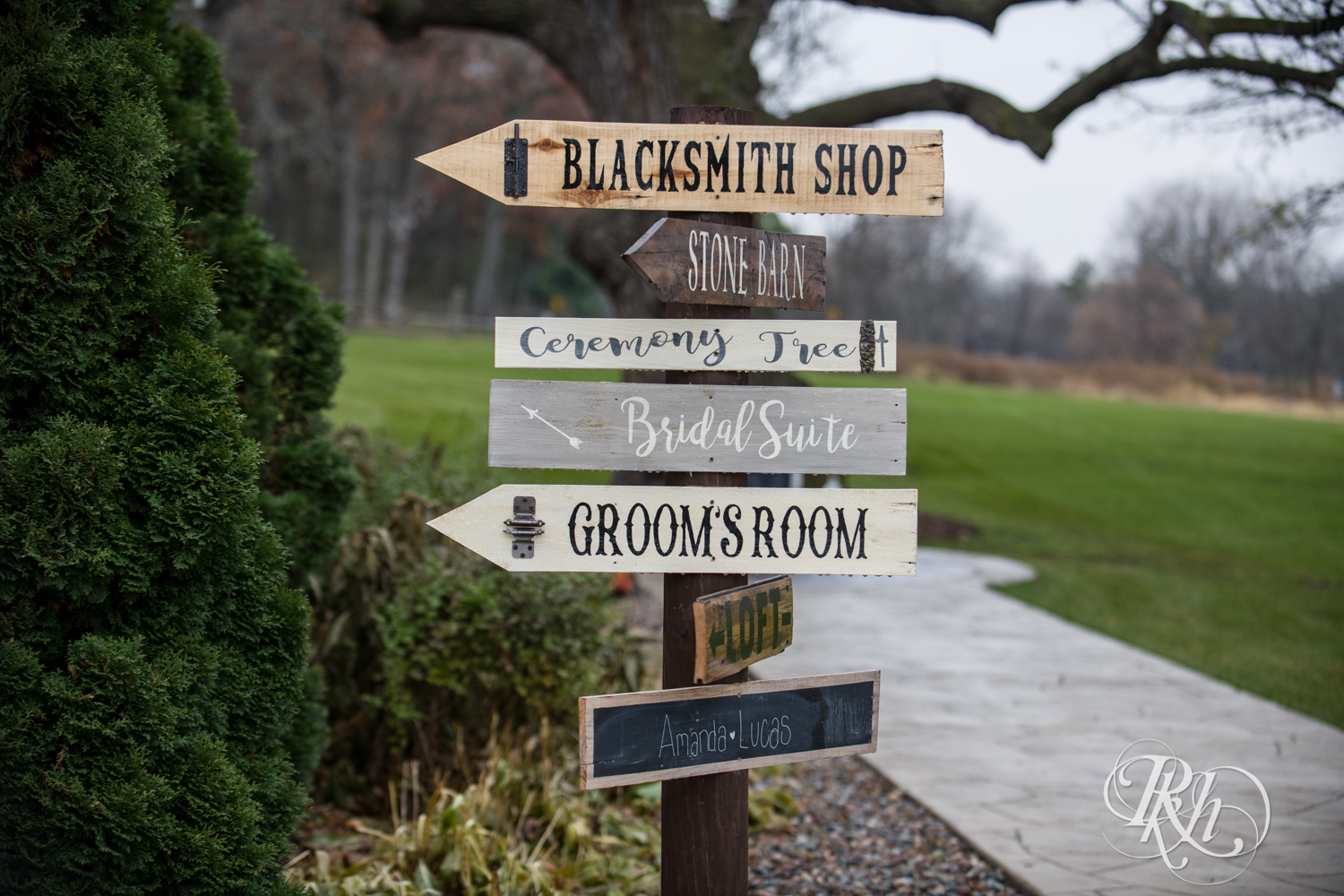 Outdoor wedding signs at Mayowood Stone Barn in Rochester, Minnesota.