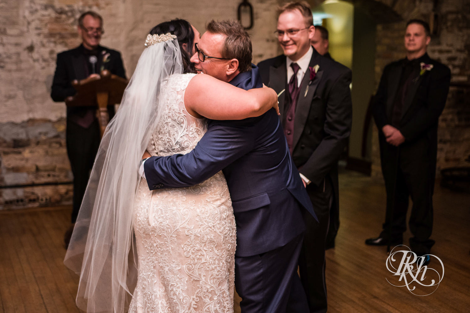 Bride hugs dad at Kellerman's Event Center in White Bear Lake, Minnesota.