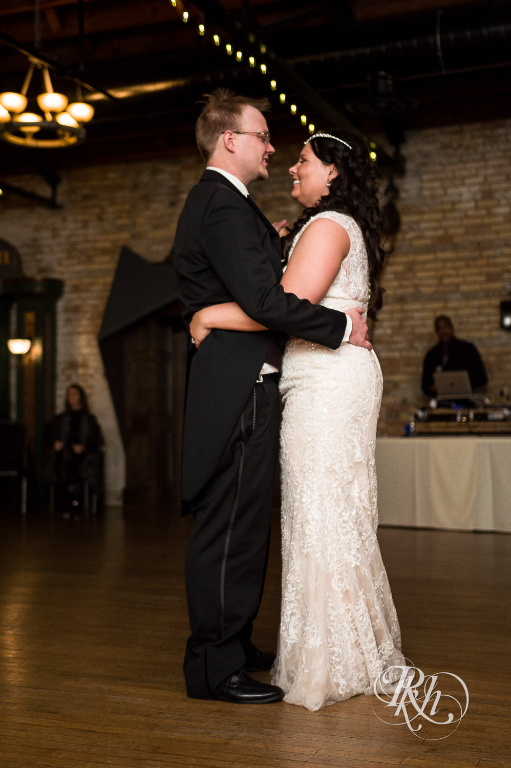 Bride and groom dance during indoor wedding reception at Kellerman's Event Center in White Bear Lake, Minnesota.