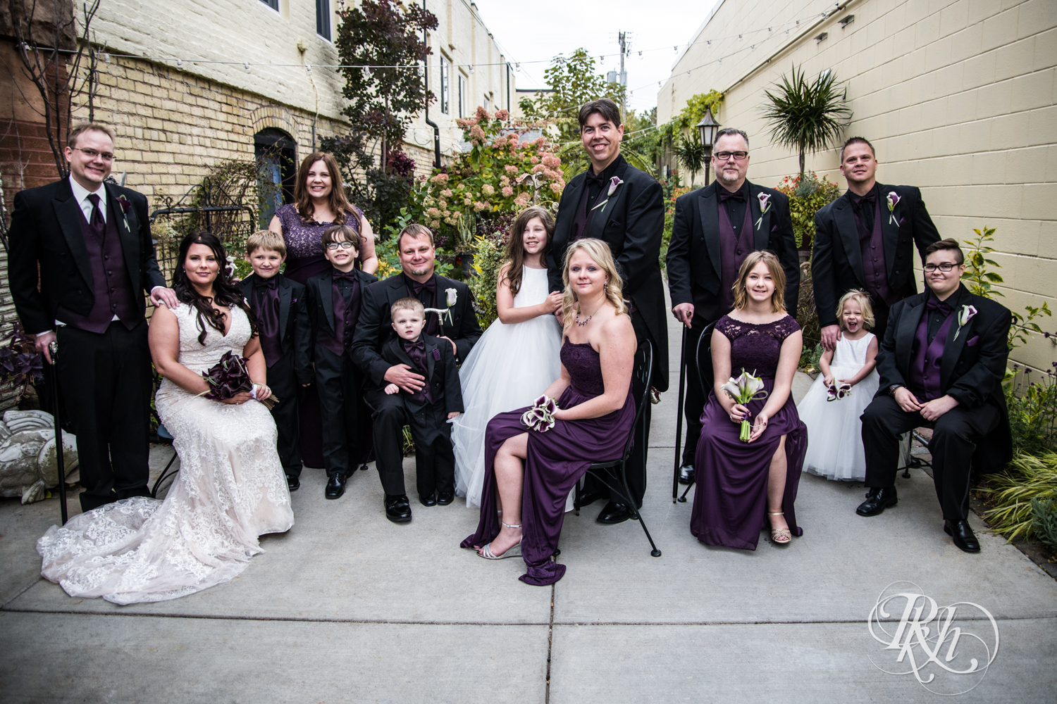 Wedding party in purple smiles at Kellerman's Event Center in White Bear Lake, Minnesota.