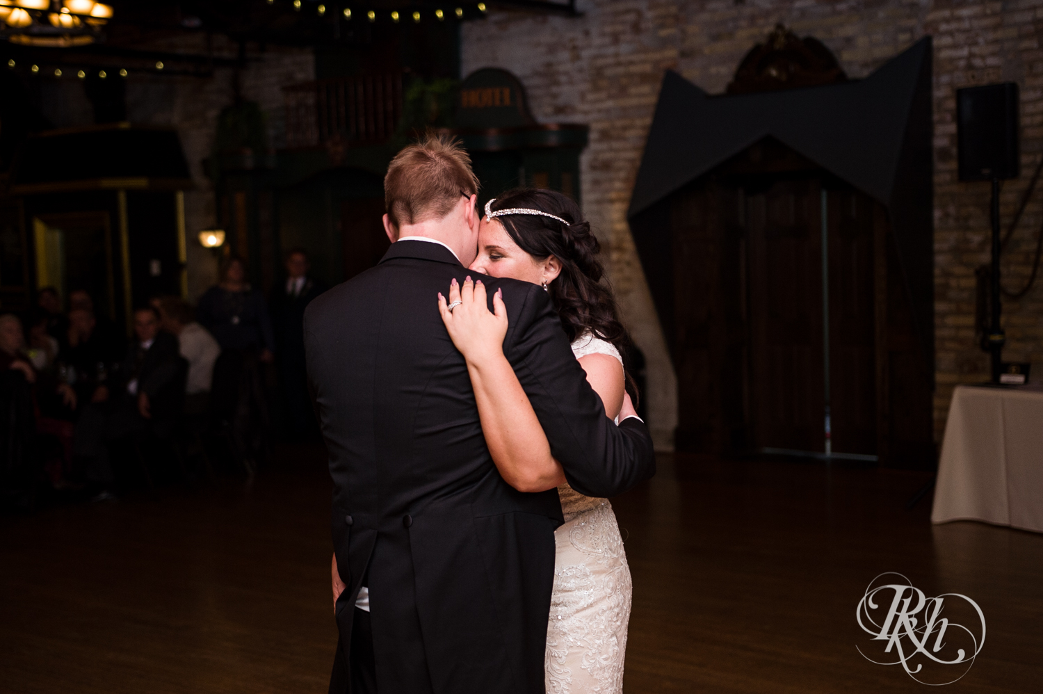 Bride and groom dance during indoor wedding reception at Kellerman's Event Center in White Bear Lake, Minnesota.