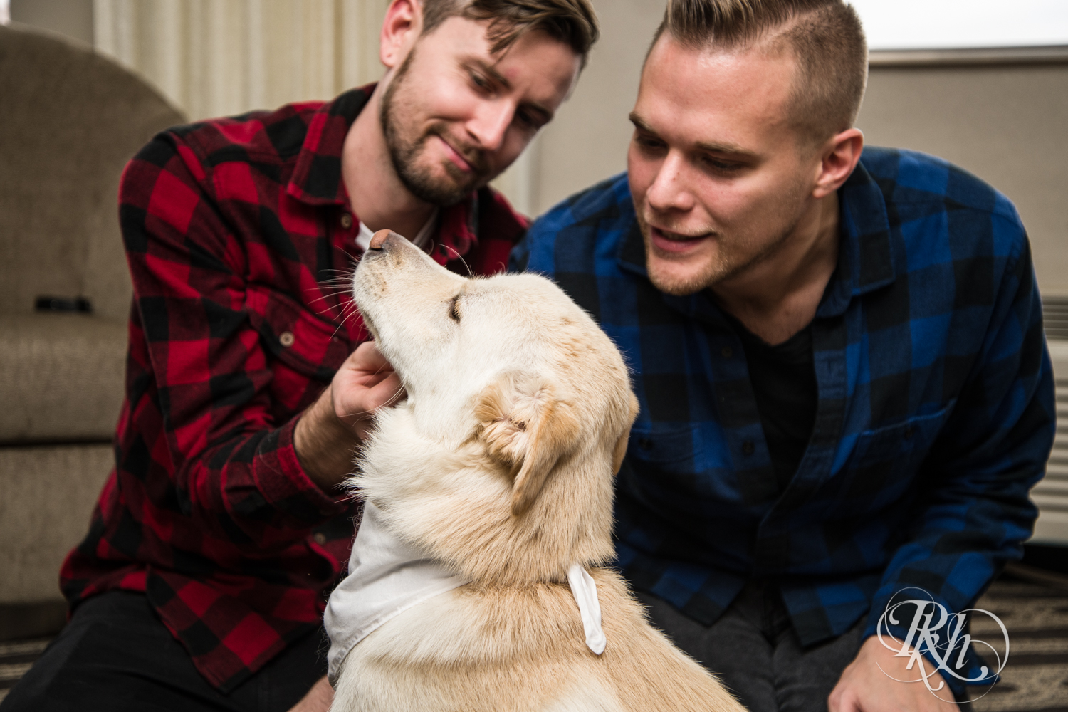 Grooms in flannels playing with their dog at Courtyard by Marriott Minneapolis in Minneapolis, Minnesota.
