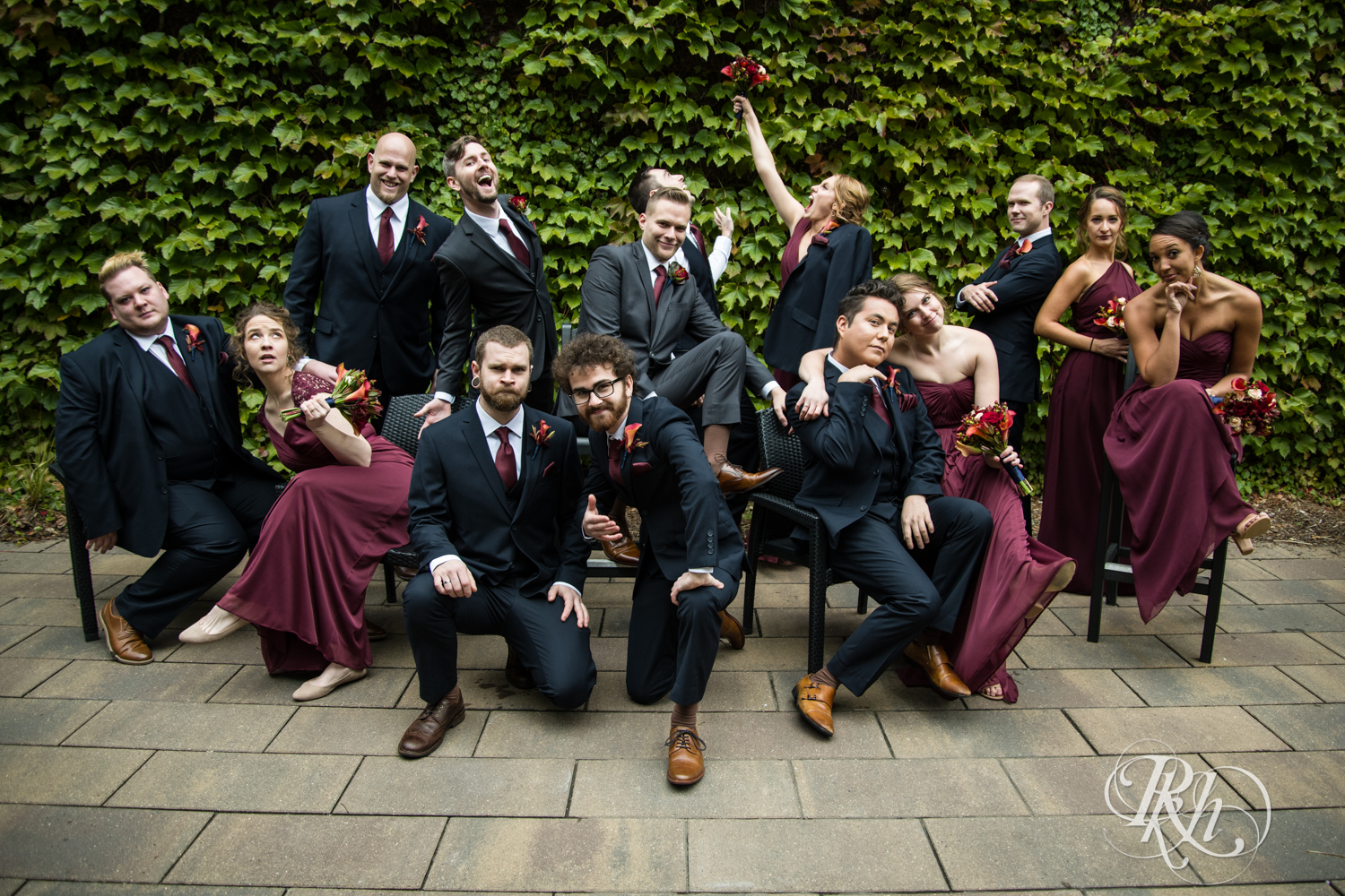 Wedding party poses with grooms in Minneapolis, Minnesota for Minnesota LGBT wedding photographer.