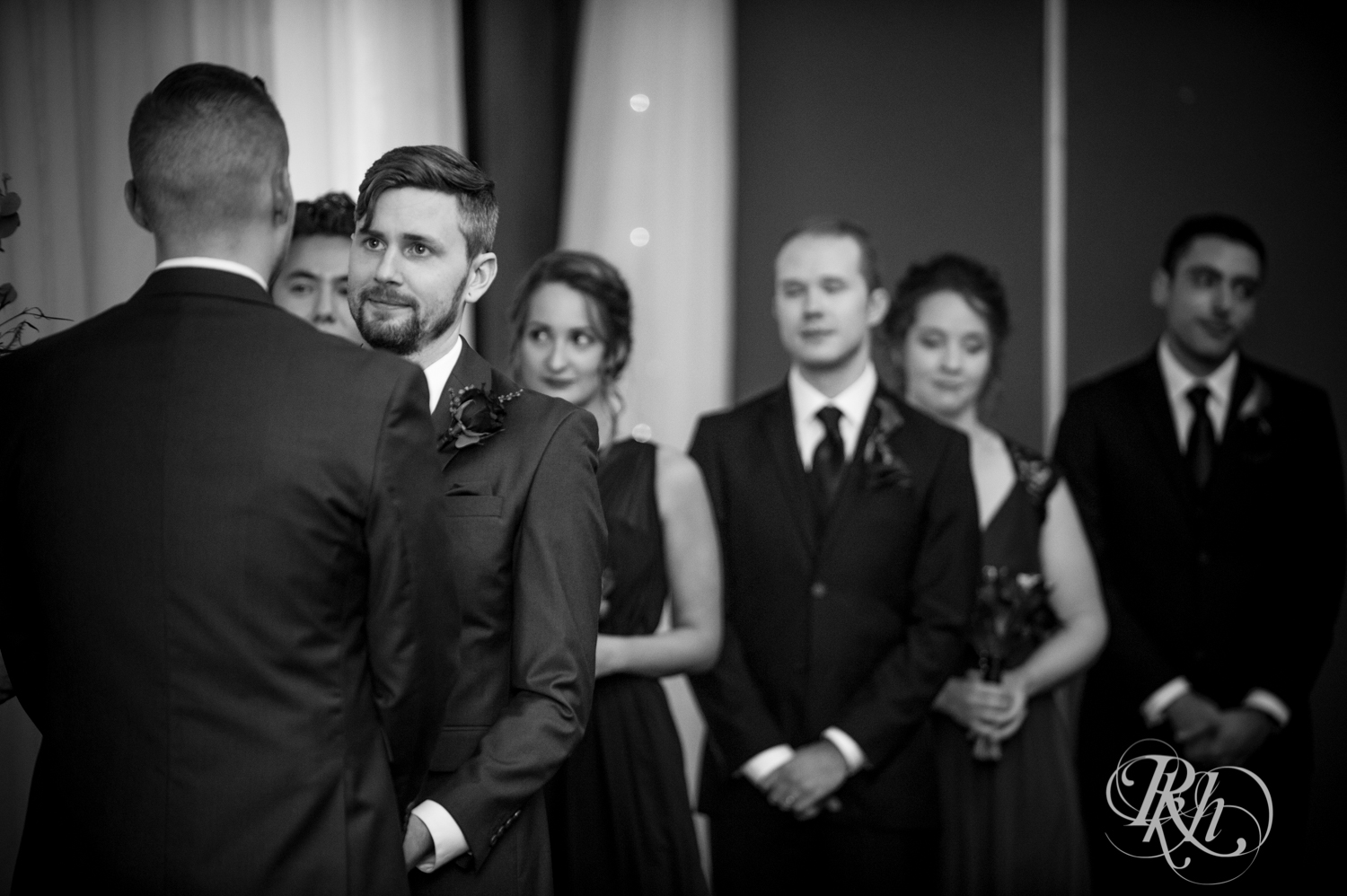 Grooms cry during LGBTQ wedding ceremony at Courtyard by Marriott Minneapolis.