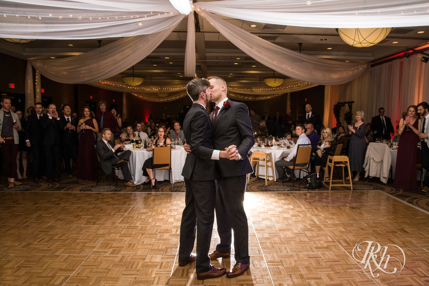 Groom share first dance at wedding reception at at Courtyard by Marriott Minneapolis.
