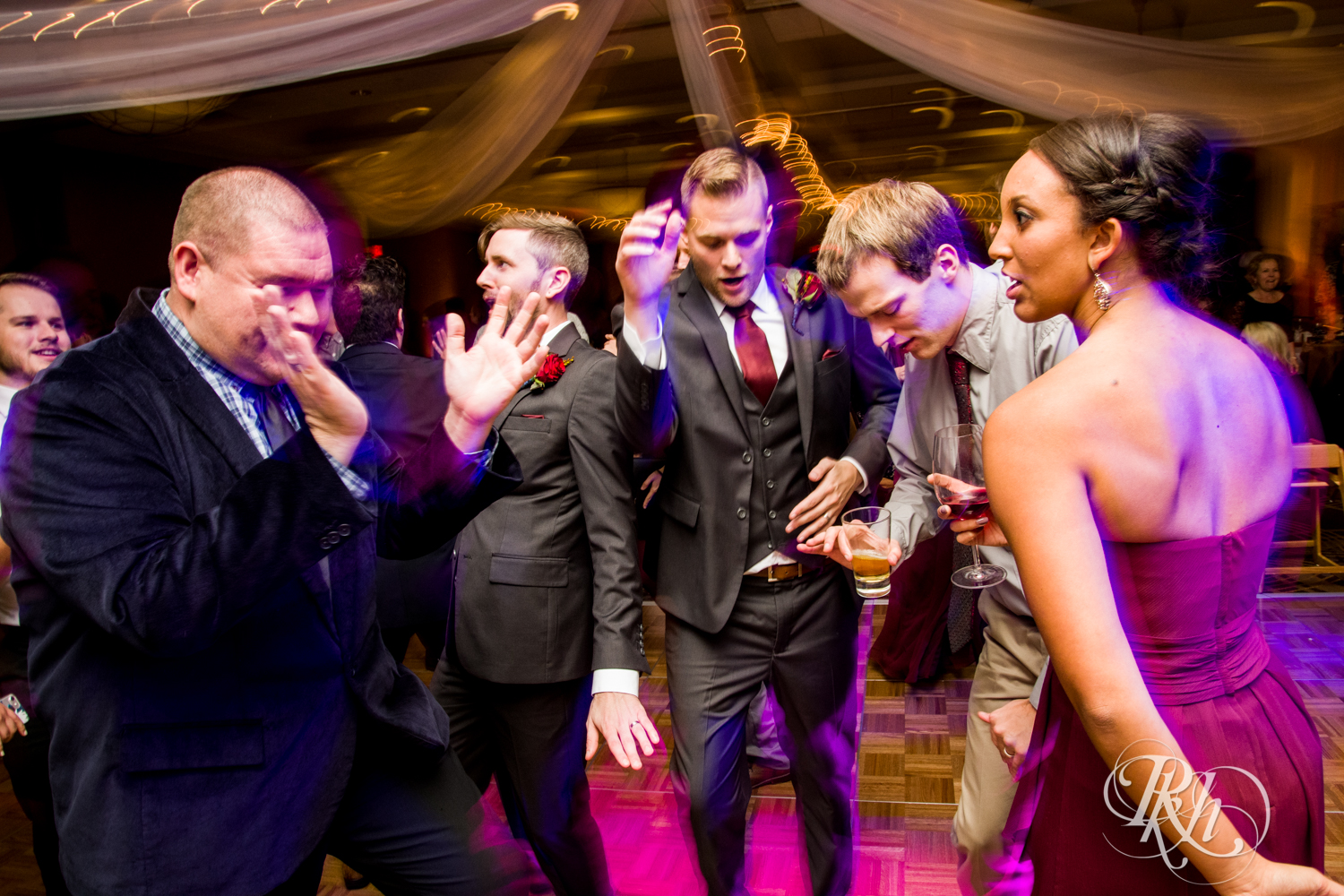 Guests dance at wedding reception at at Courtyard by Marriott Minneapolis.