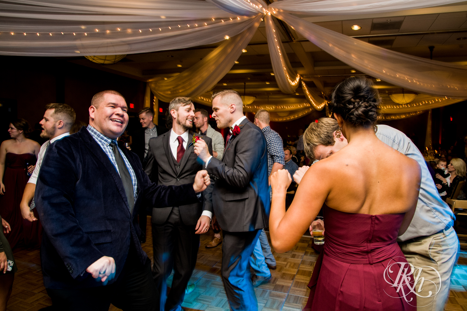 Guests dance at wedding reception at at Courtyard by Marriott Minneapolis.