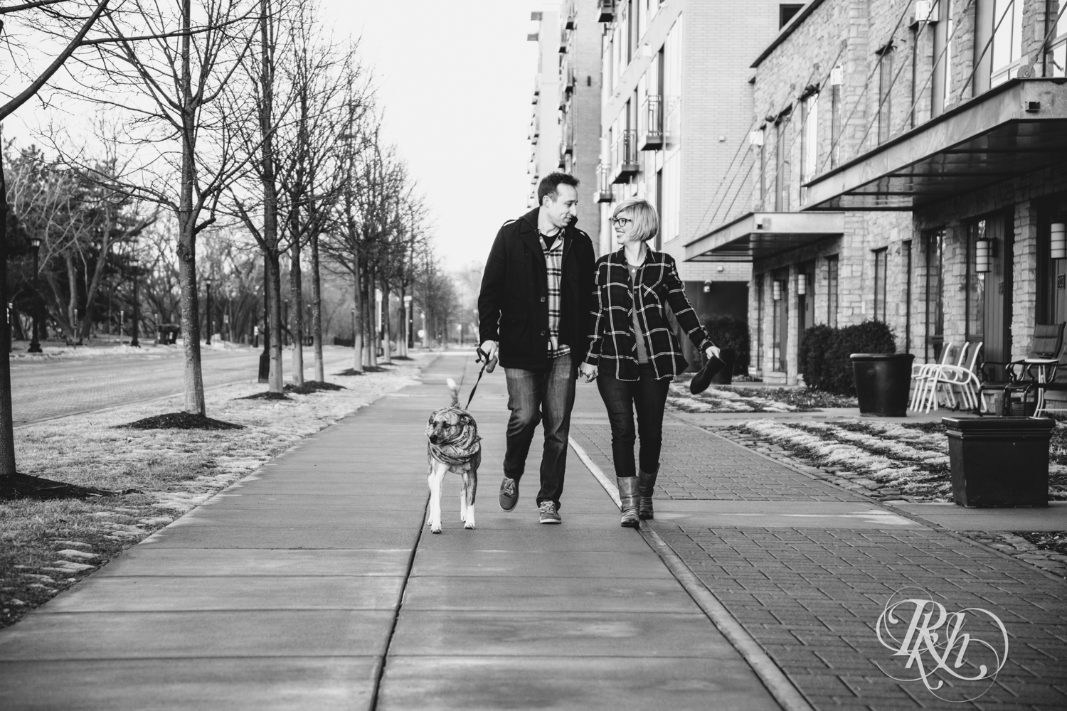 couple walking dog