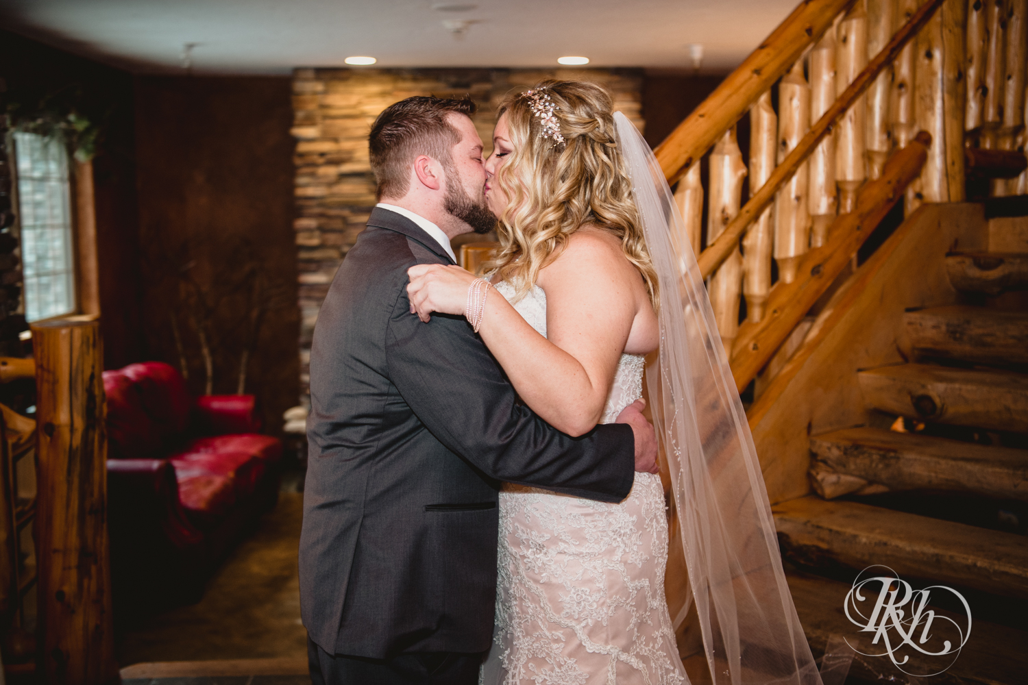 Bride and groom kiss each other at first look at Whitefish Lodge in Crosslake, Minnesota.