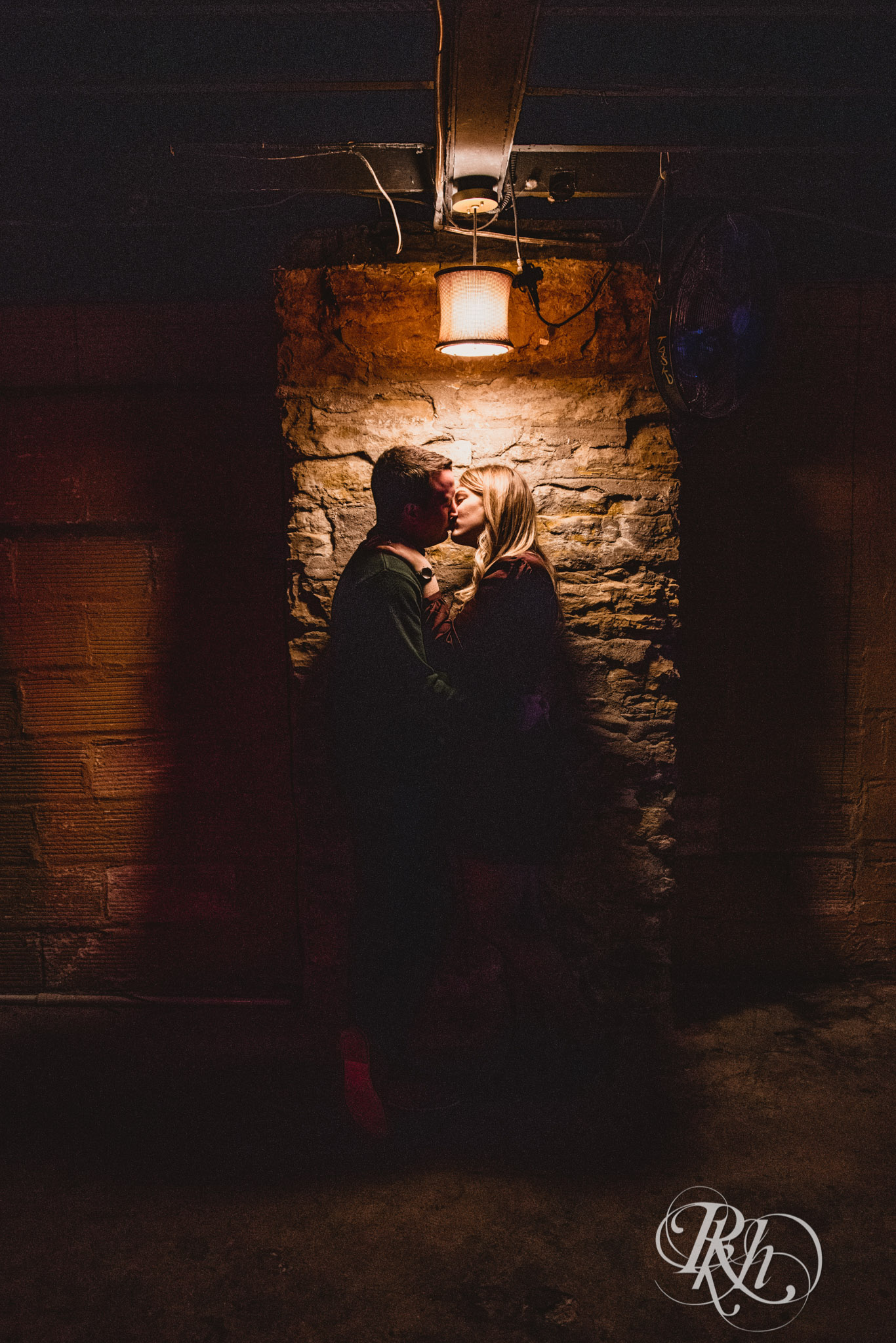 Man and woman kiss at Honey Lounge in Minneapolis, Minnesota.