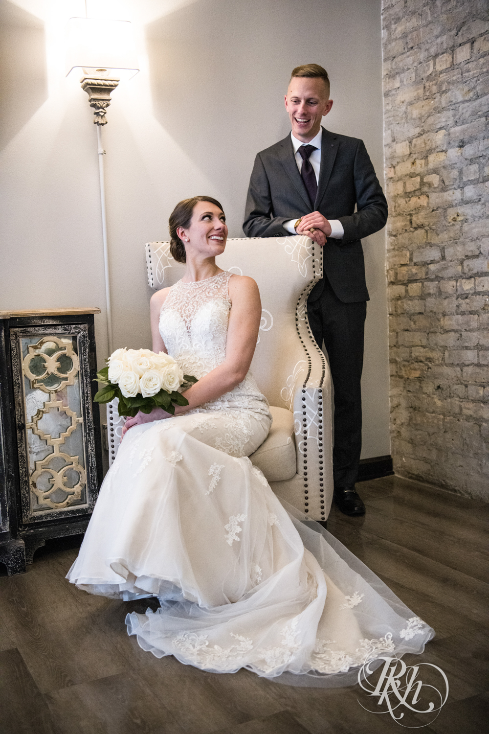 Bride and groom smile in the Lumber Exchange Event Center in Minneapolis, Minnesota.