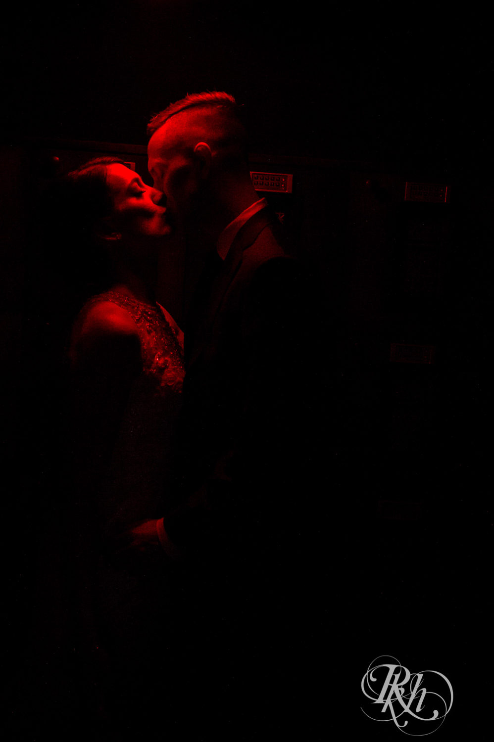 Bride and groom kiss in the Lumber Exchange Event Center in Minneapolis, Minnesota.