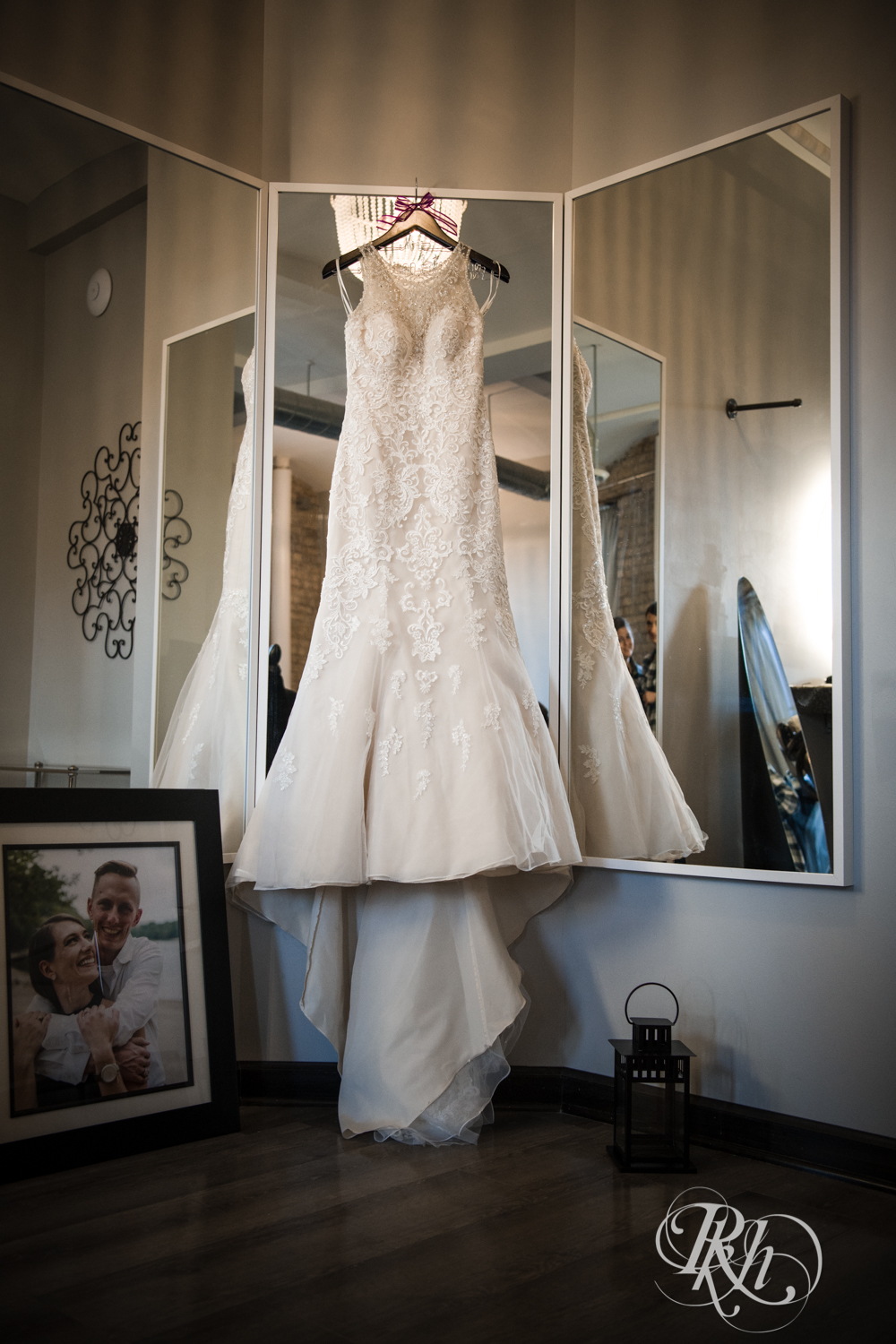Wedding dress hung on mirror in the Lumber Exchange Event Center in Minneapolis, Minnesota.