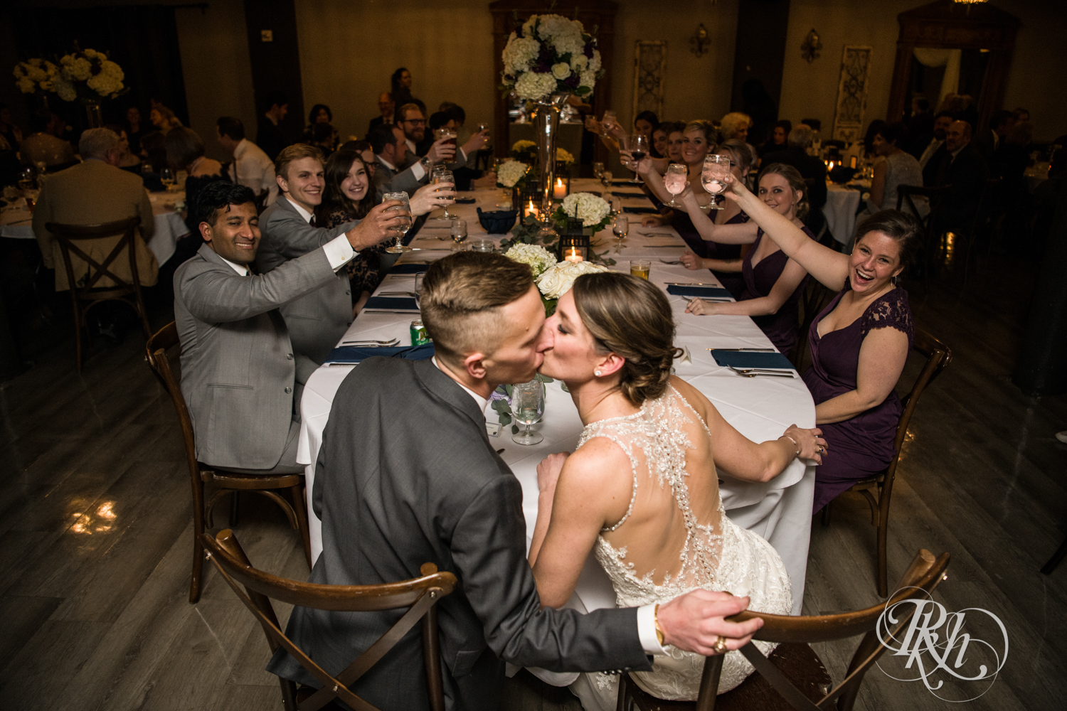 Bride and groom kiss at wedding reception at the Lumber Exchange Event Center in Minneapolis, Minnesota.
