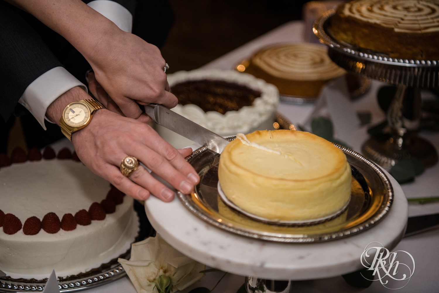 Bride and groom cut cake at wedding reception at the Lumber Exchange Event Center in Minneapolis, Minnesota.