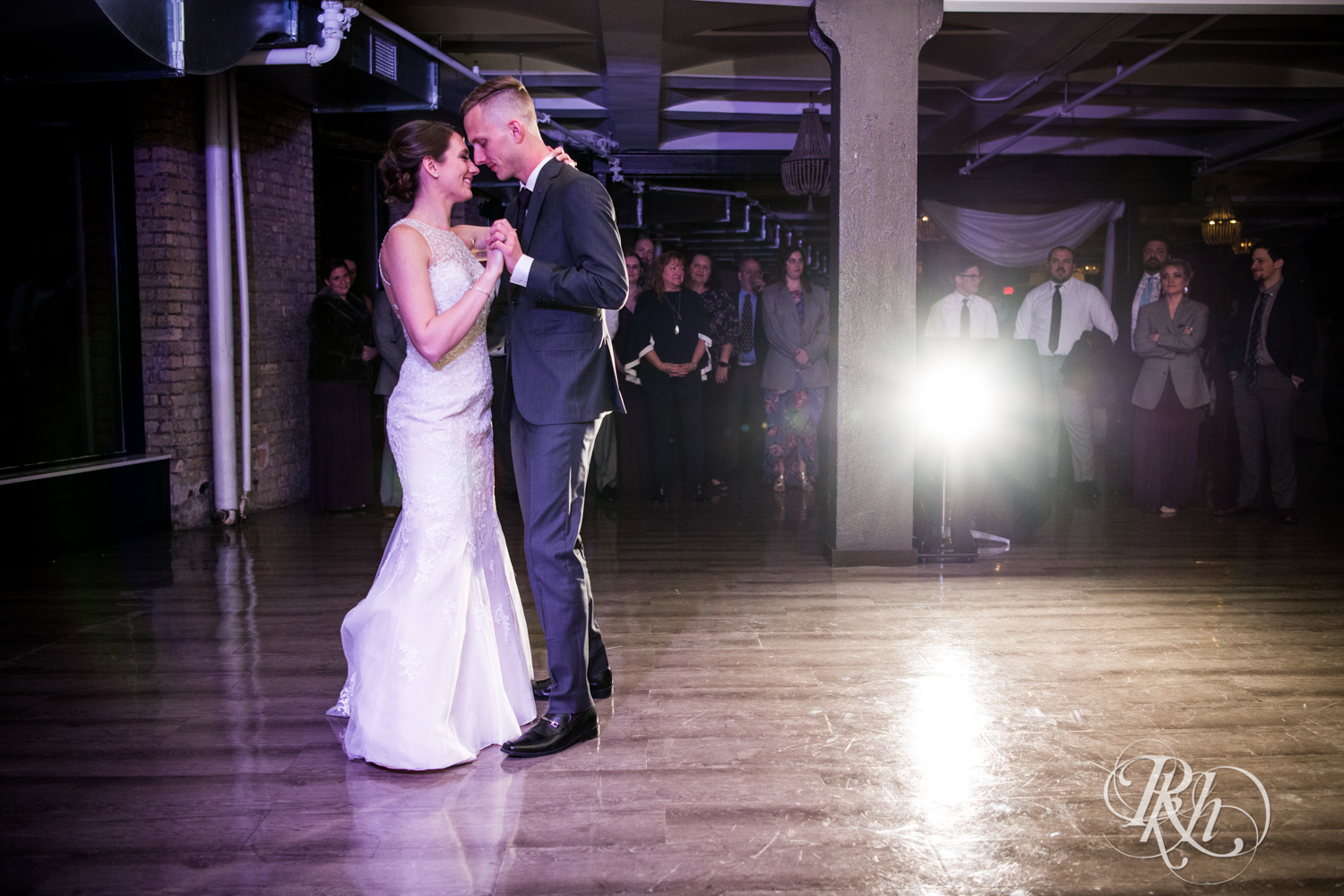 Bride and groom share first dance at wedding reception at Lumber Exchange Event Center in Minneapolis, Minnesota.