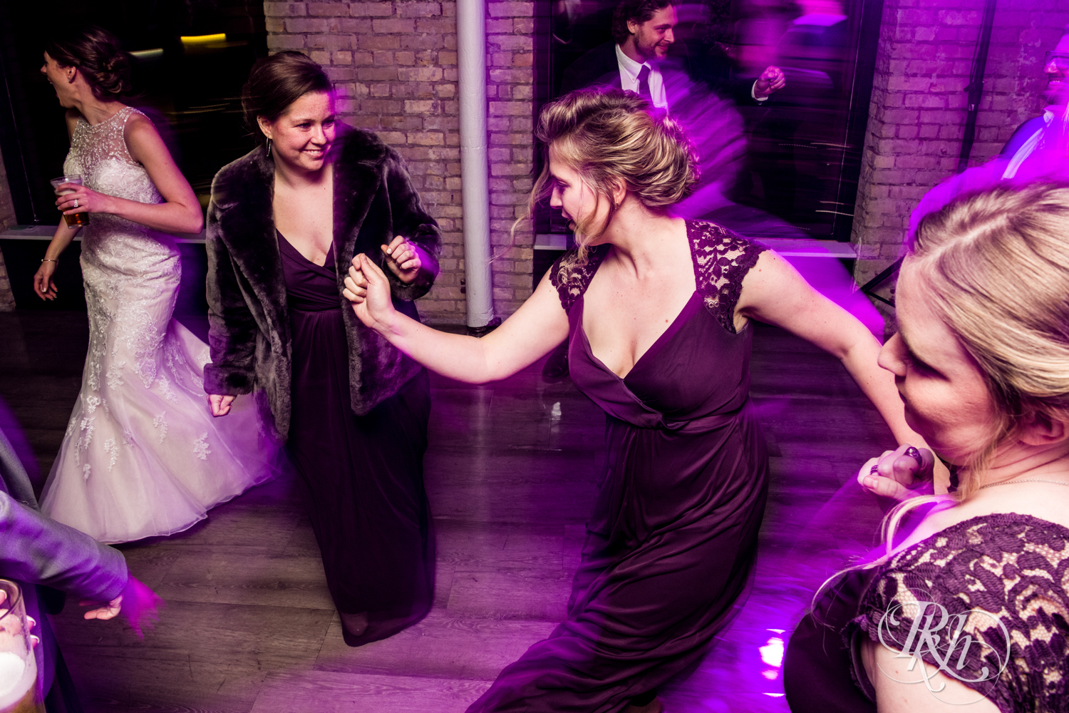Guests dance at wedding reception at Lumber Exchange Event Center in Minneapolis, Minnesota.