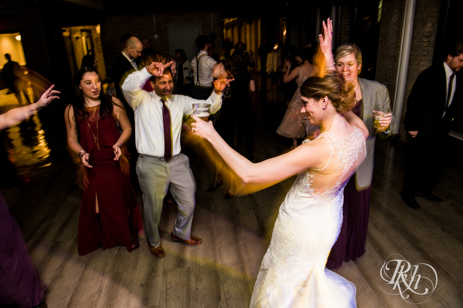 Guests dance at wedding reception at Lumber Exchange Event Center in Minneapolis, Minnesota.