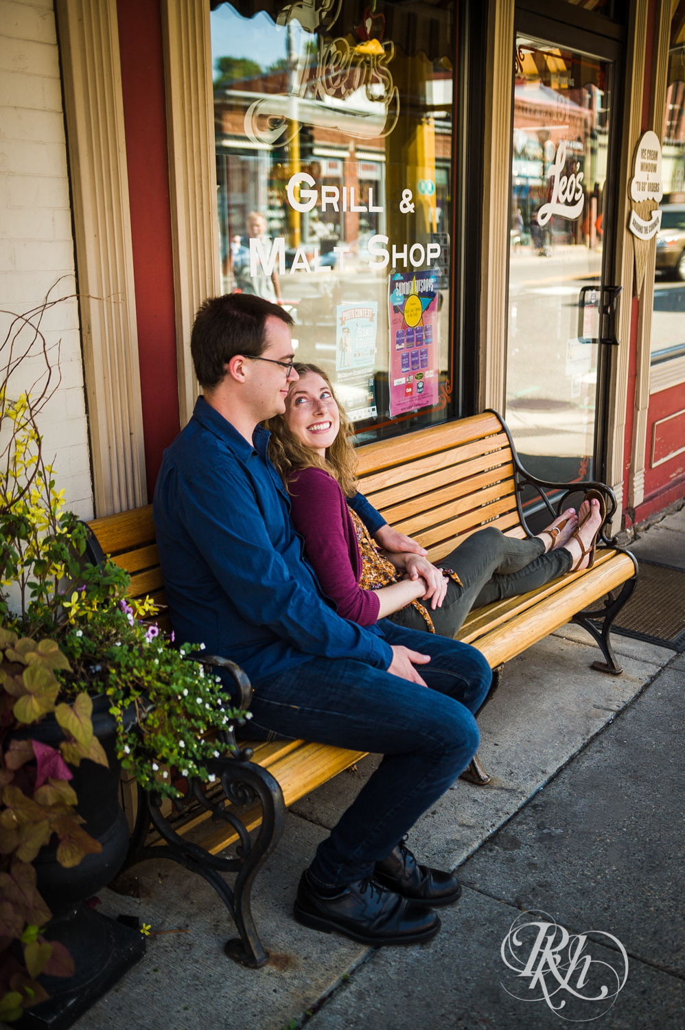 Man and woman smile on a bench in Stillwater, Minnesota.