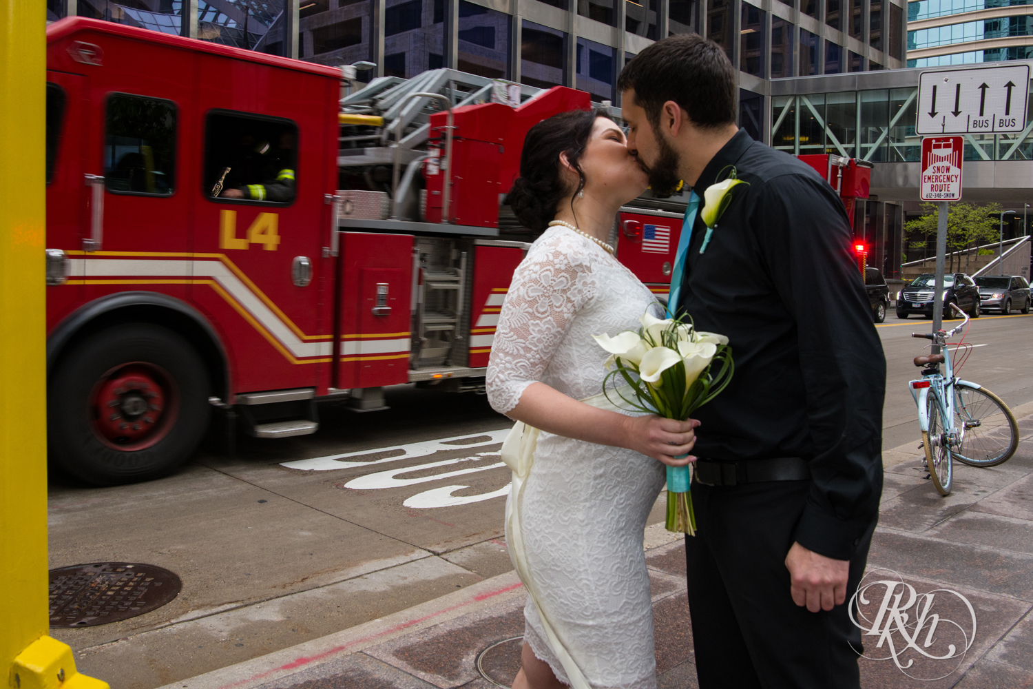 Bride and groom in front of fire truck