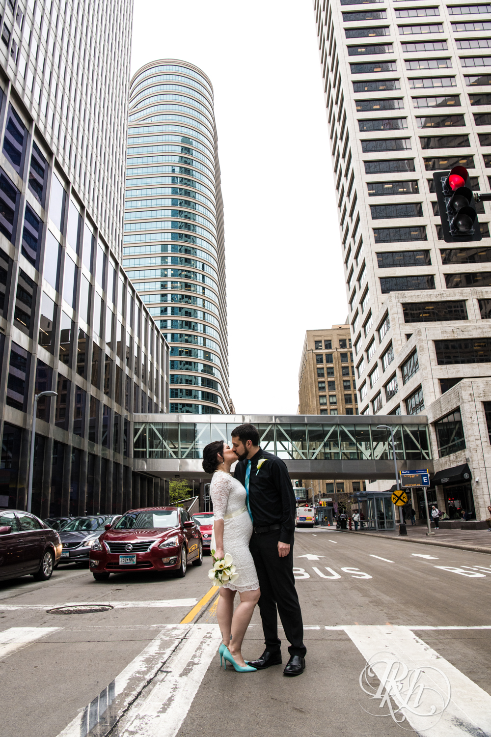 Bride and groom kiss in Minneapolis, Minnesota before their courthouse wedding.