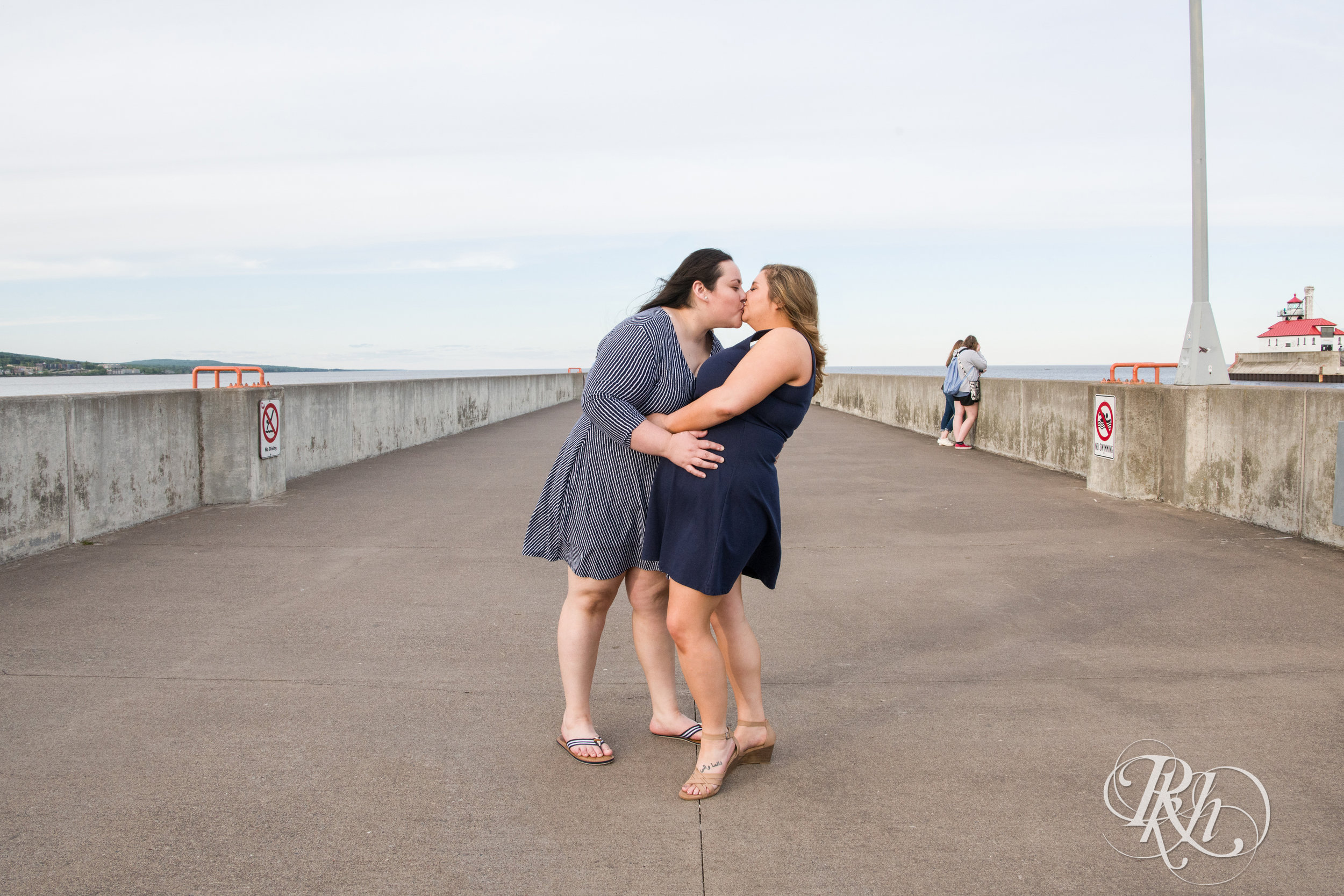 Lesbian couple kiss during engagement session in Duluth, Minnesota.