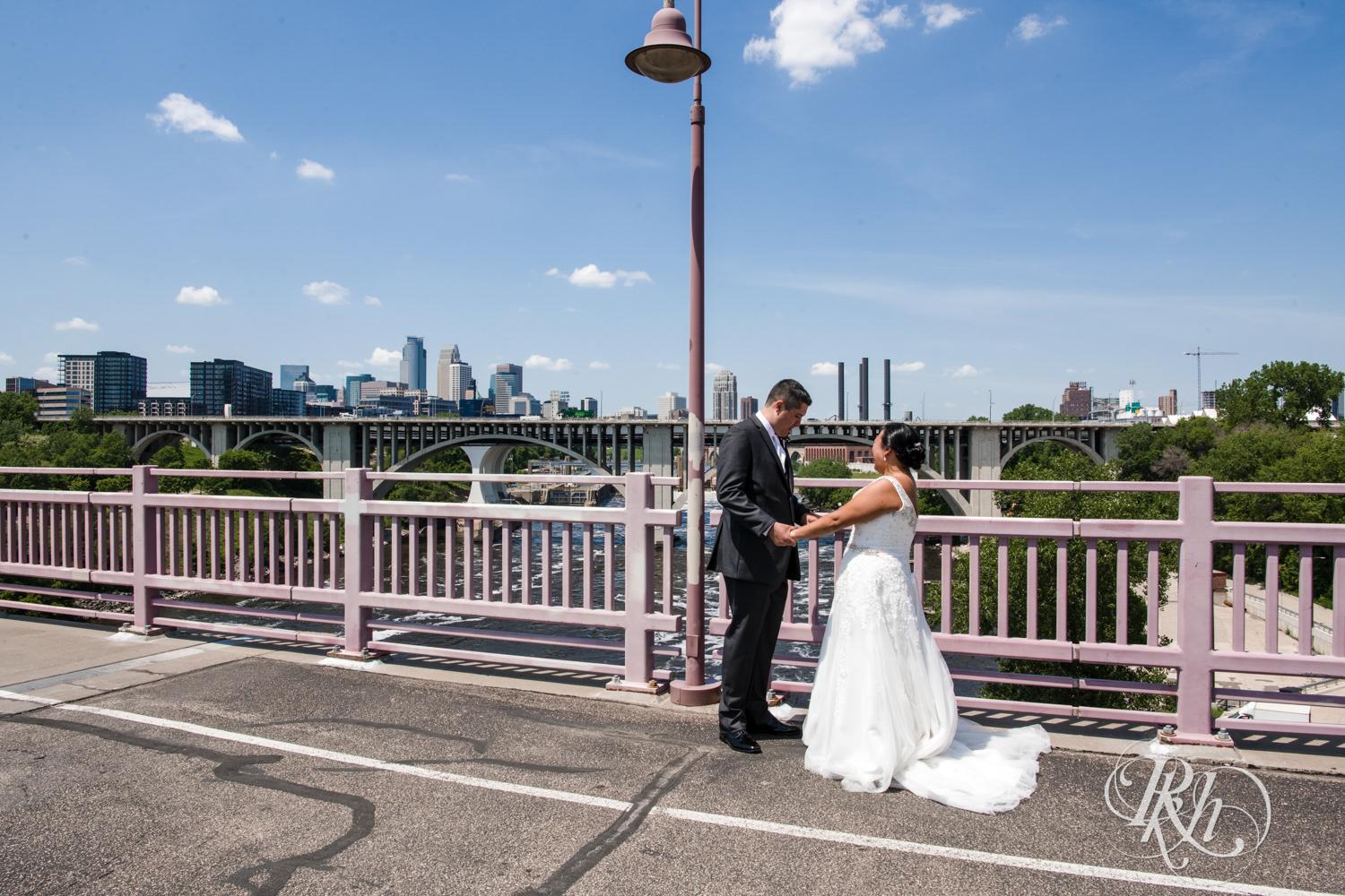 Bride and groom share first look on the 10th Avenue Bridge in Minneapolis, Minnesota.