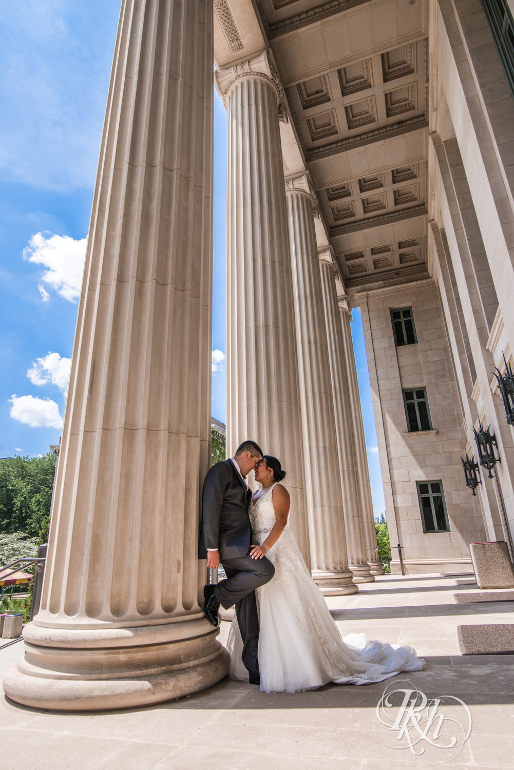 Bride and groom kiss at the Northrup Auditorium in Minneapolis, Minnesota.