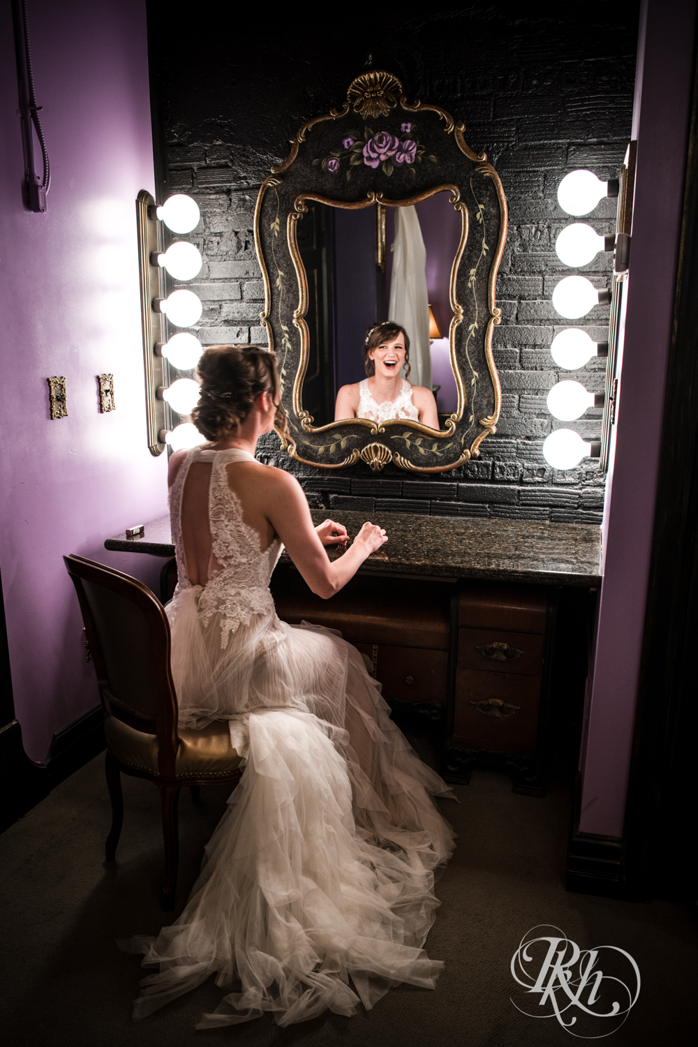 Bride laughing in getting ready suite at Kellerman's Event Center in White Bear Lake, Minnesota.