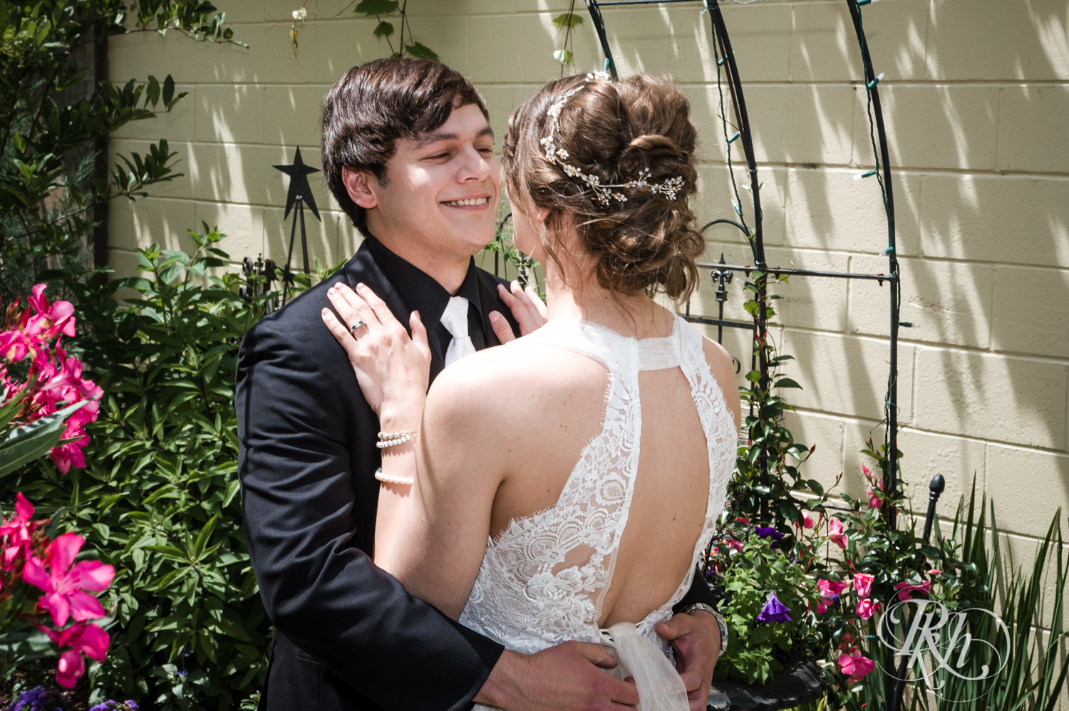 Bride and groom share first look during summer at Kellerman's Event Center in White Bear Lake, Minnesota.