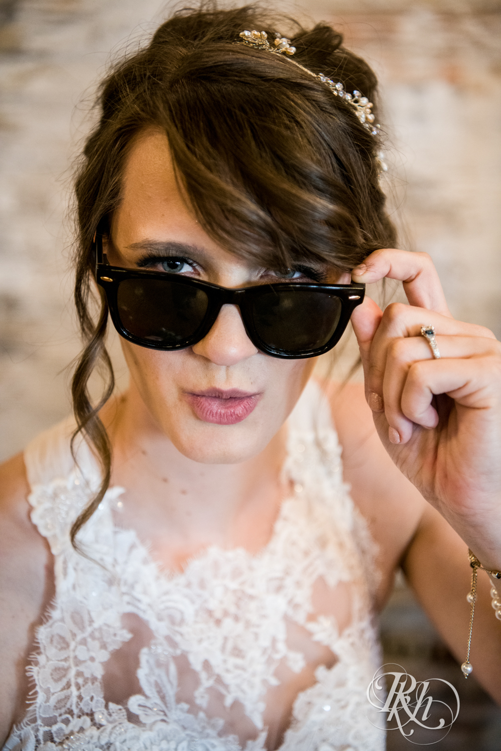 Bride wears sunglasses at Kellerman's Event Center in White Bear Lake, Minnesota.