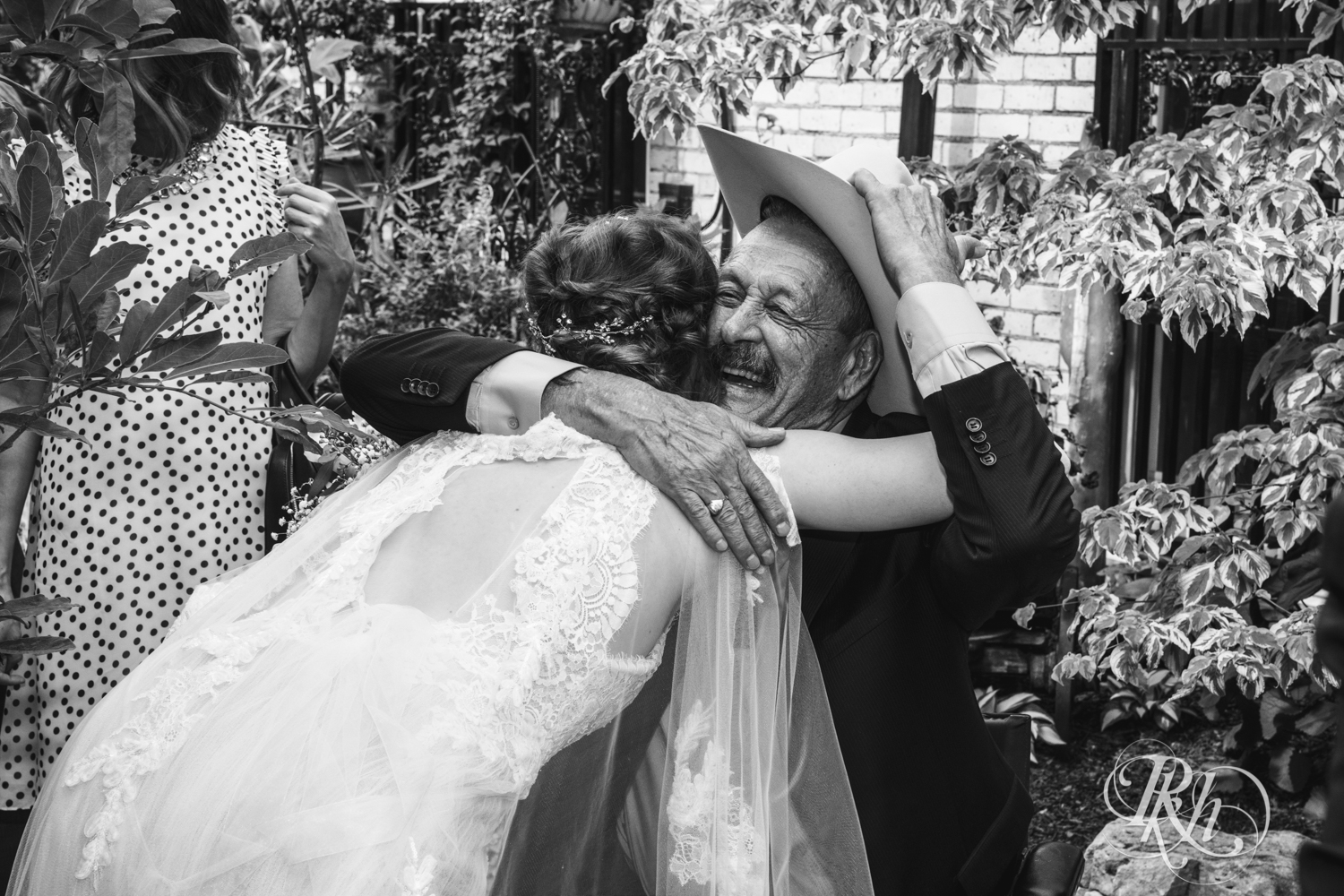 Bride hugs grandpa at Kellerman's Event Center in White Bear Lake, Minnesota.