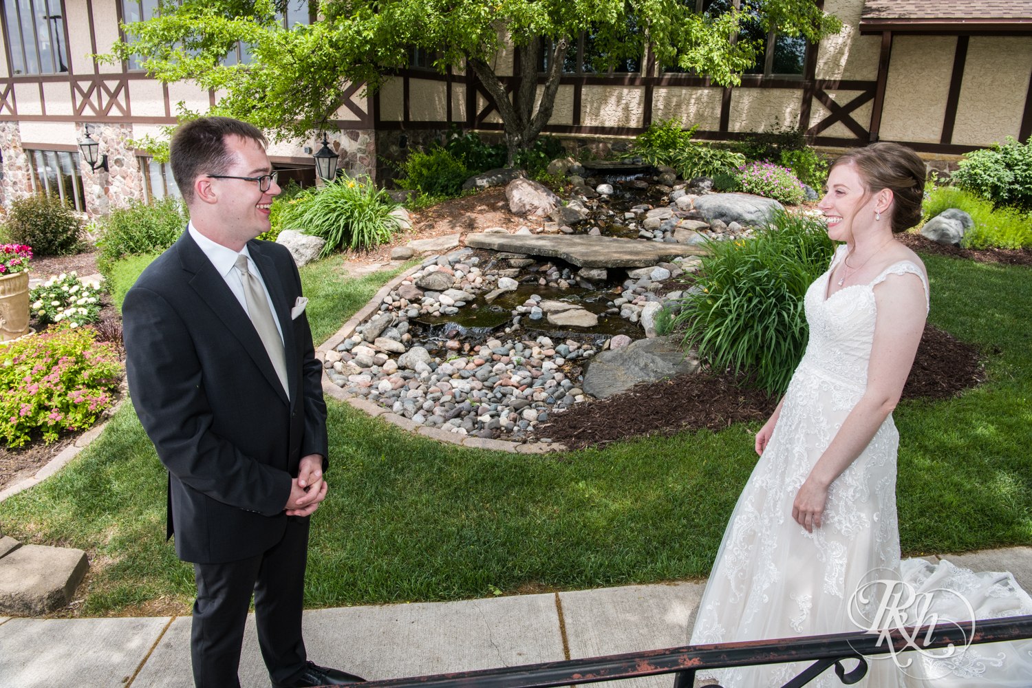 Bride and groom share first look at Oak Glen Golf Course in Stillwater, Minnesota.