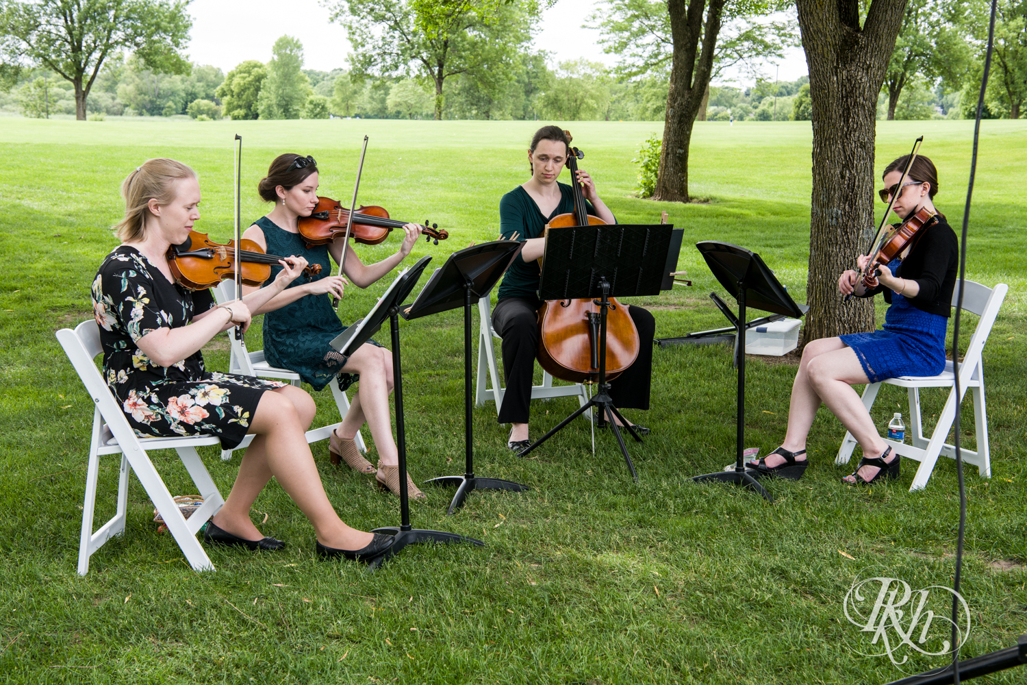 String quartet play wedding ceremony at Oak Glen Golf Course in Stillwater, Minnesota.