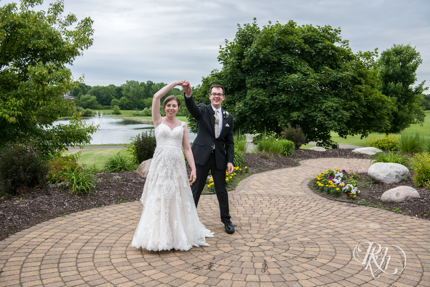 Bride and groom dance after wedding ceremony at Oak Glen Golf Course in Stillwater, Minnesota.