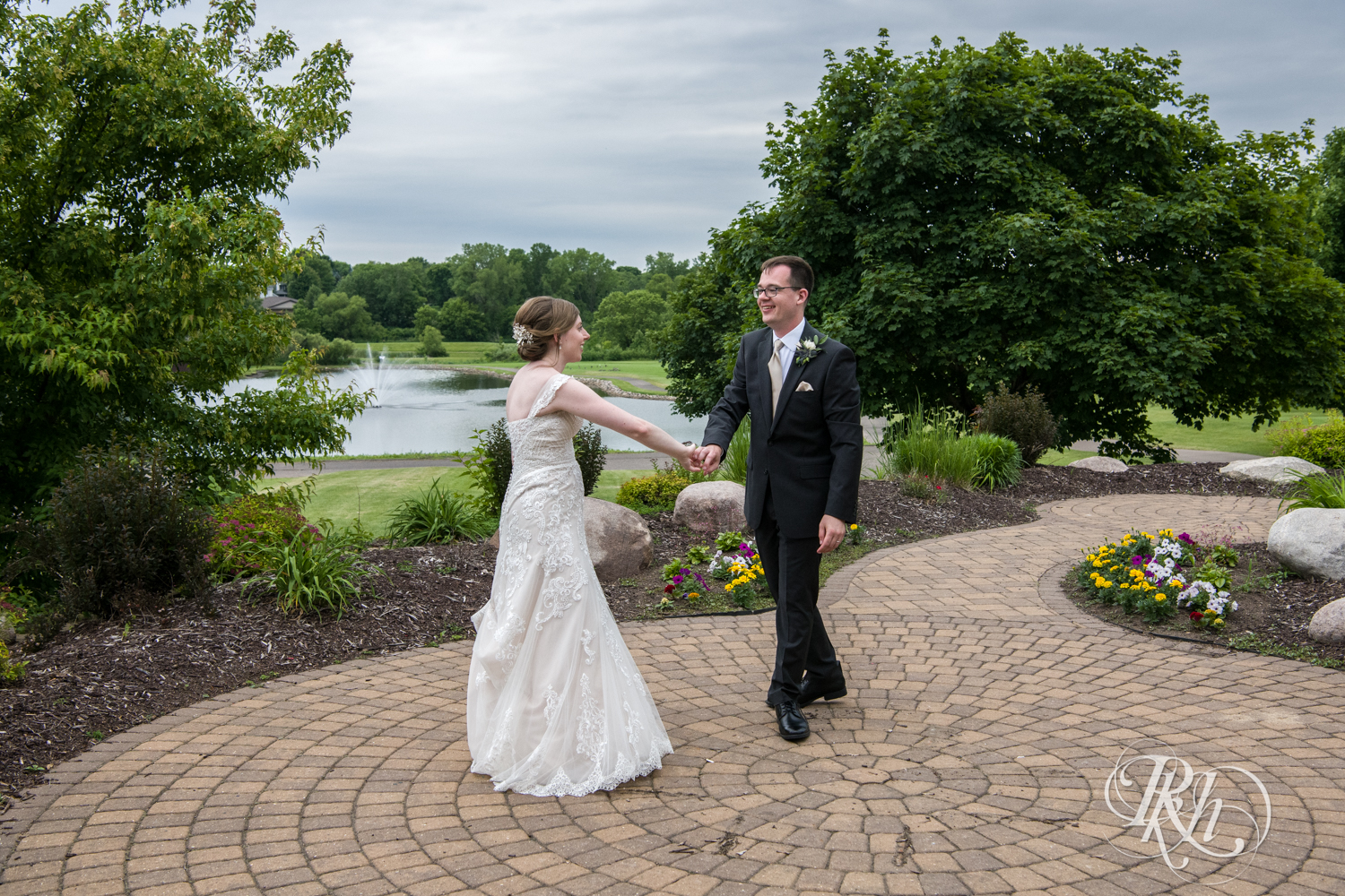 Bride and groom dance after wedding ceremony at Oak Glen Golf Course in Stillwater, Minnesota.
