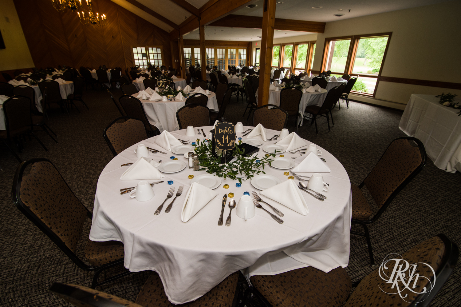 Indoor wedding reception setup at Oak Glen Golf Course in Stillwater, Minnesota.