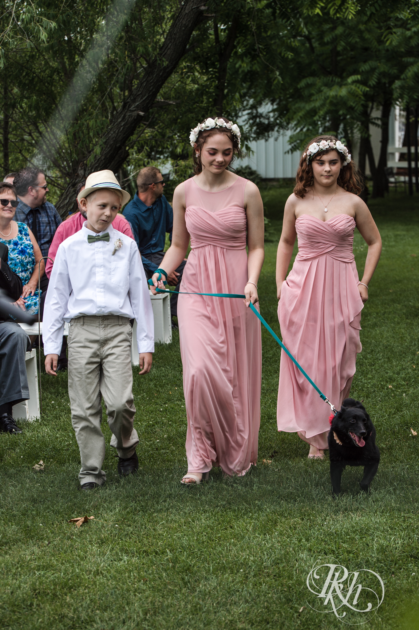 Wedding party walking dog down aisle at Next Chapter Winery in New Prague, Minnesota.
