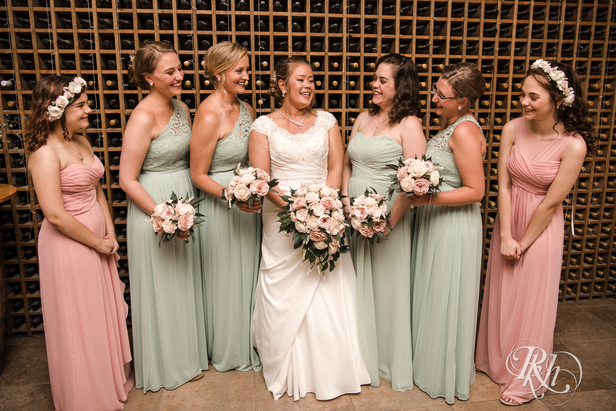Wedding party smiling at Next Chapter Winery in New Prague, Minnesota.