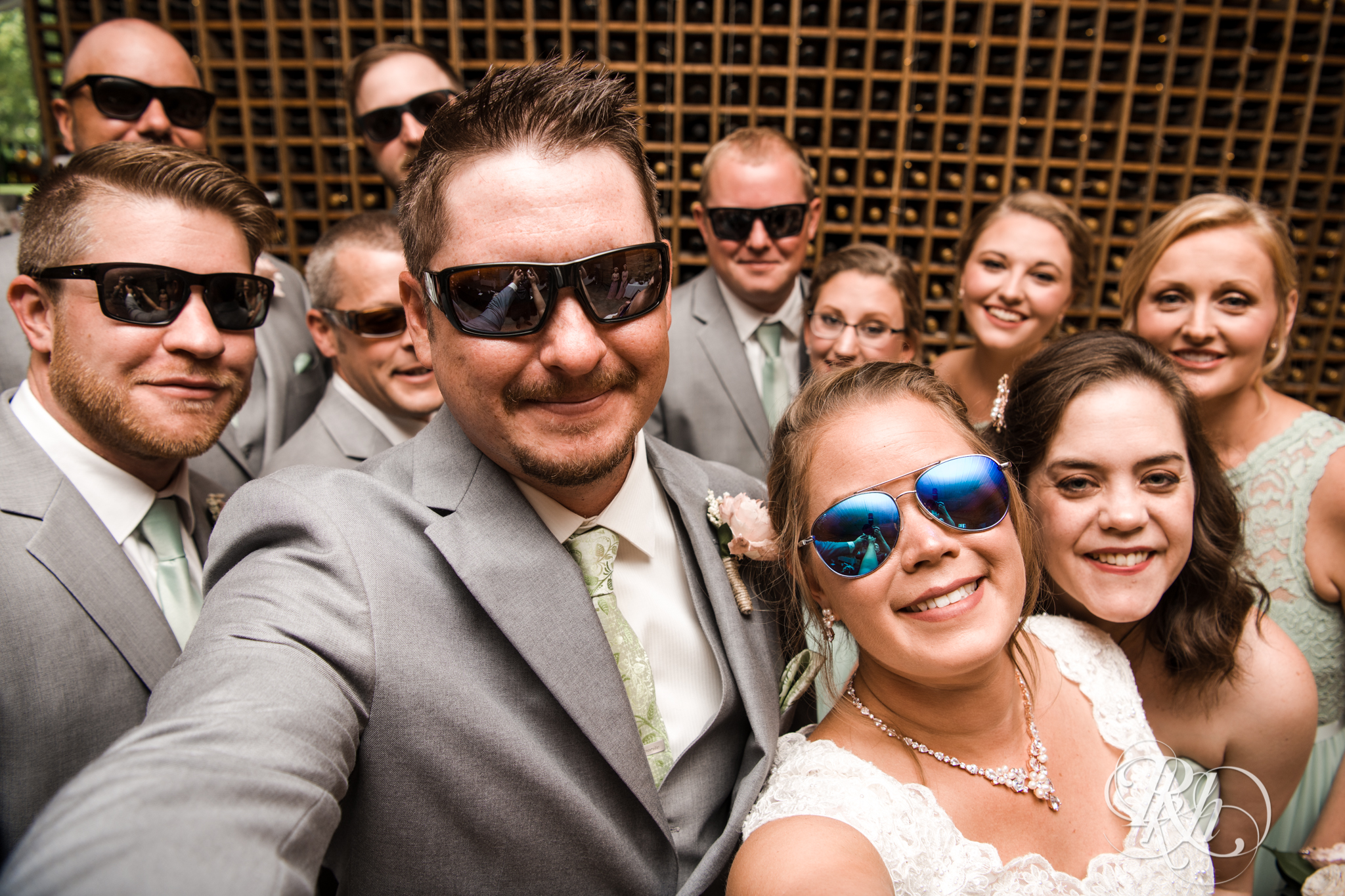 Wedding party smiling in sunglasses at Next Chapter Winery in New Prague, Minnesota.