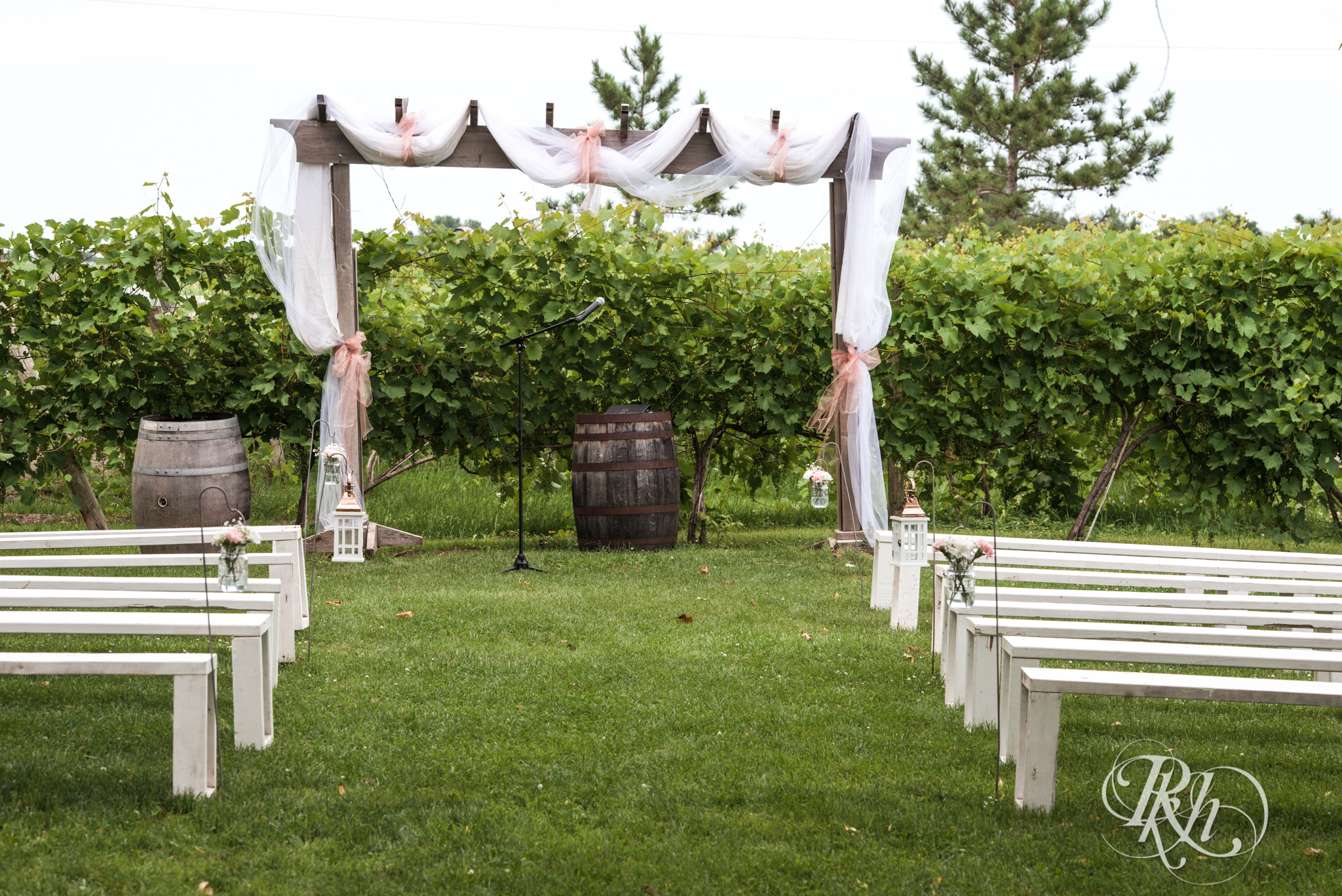 Outdoor summer wedding ceremony setup at Next Chapter Winery in New Prague, Minnesota.