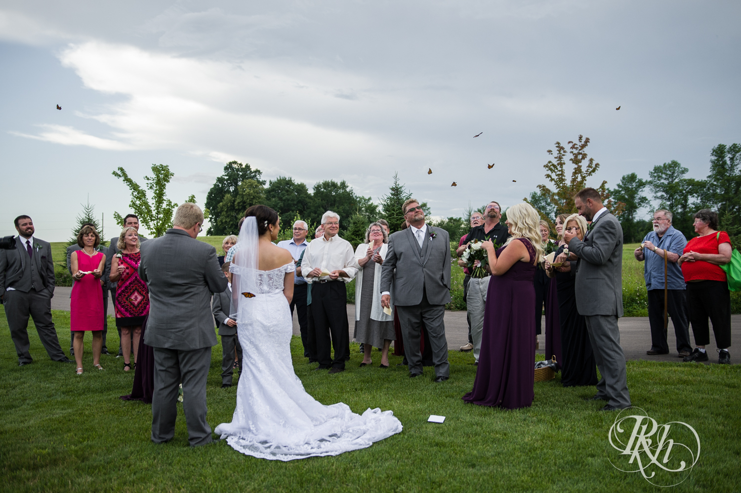 Bride and groom release butterflies at Creekside Farm Weddings and Events in Rush City, Minnesota.