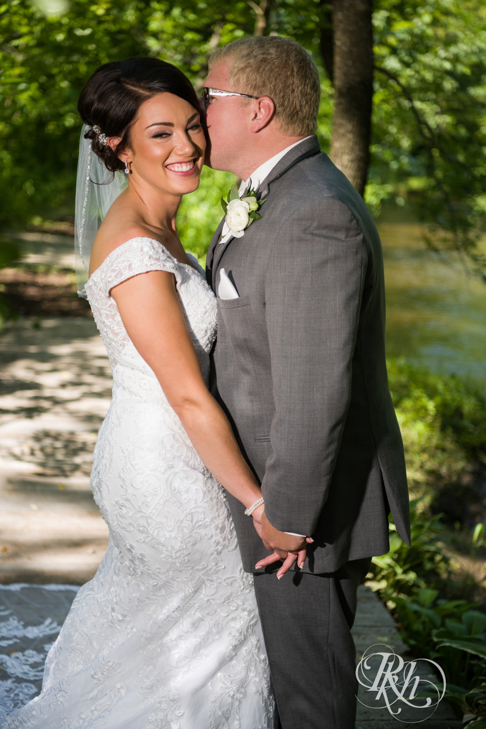 Bride and groom smile at Creekside Farm Weddings and Events in Rush City, Minnesota.