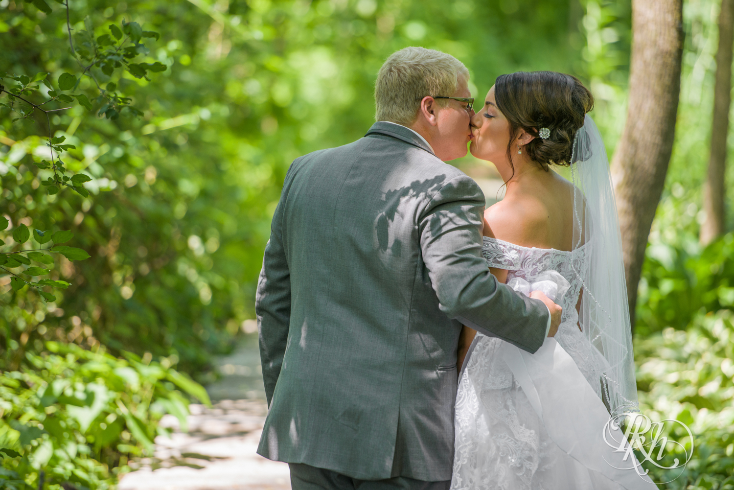 Bride and groom kiss at Creekside Farm Weddings and Events in Rush City, Minnesota.