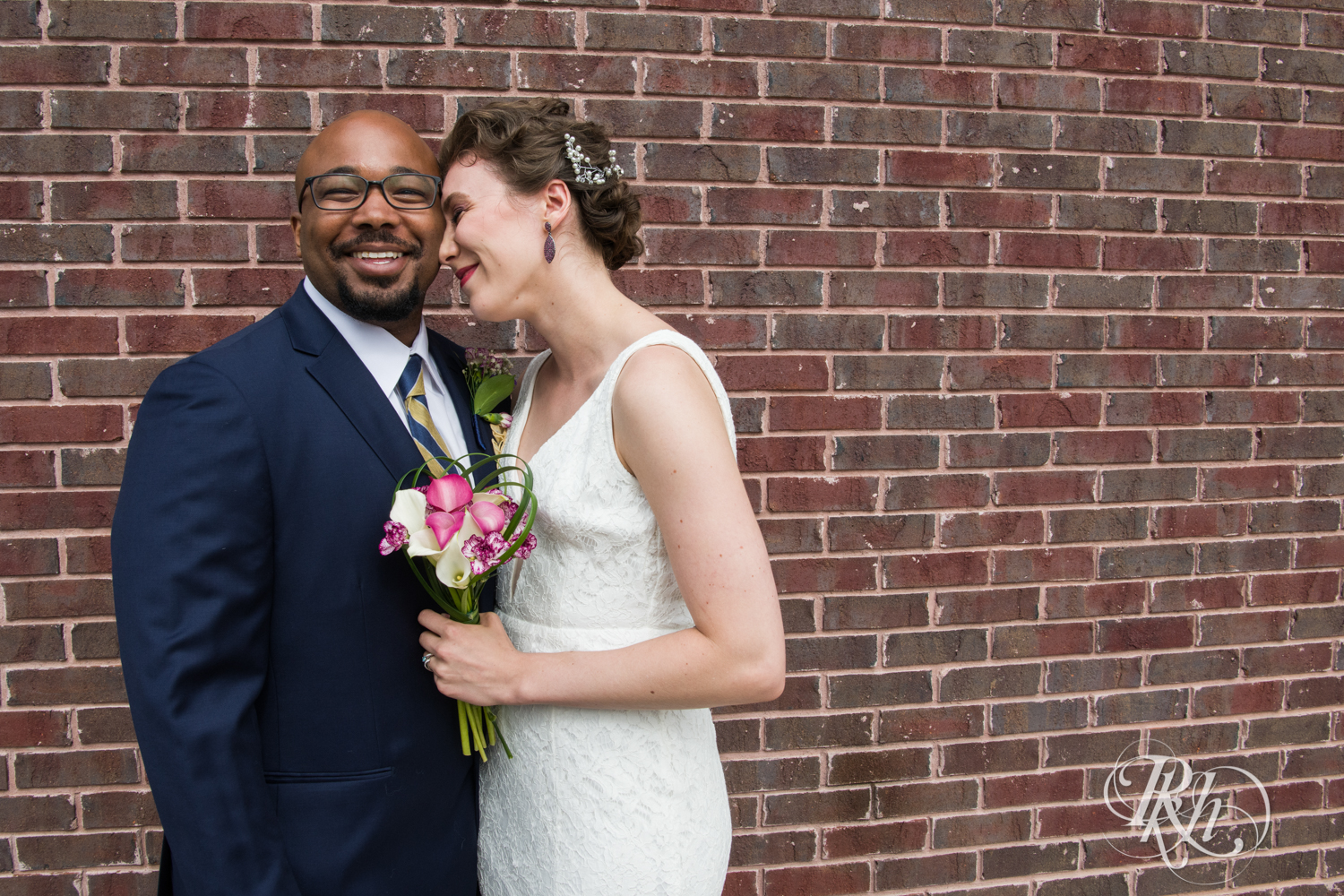 Biracial bride and groom laughing
