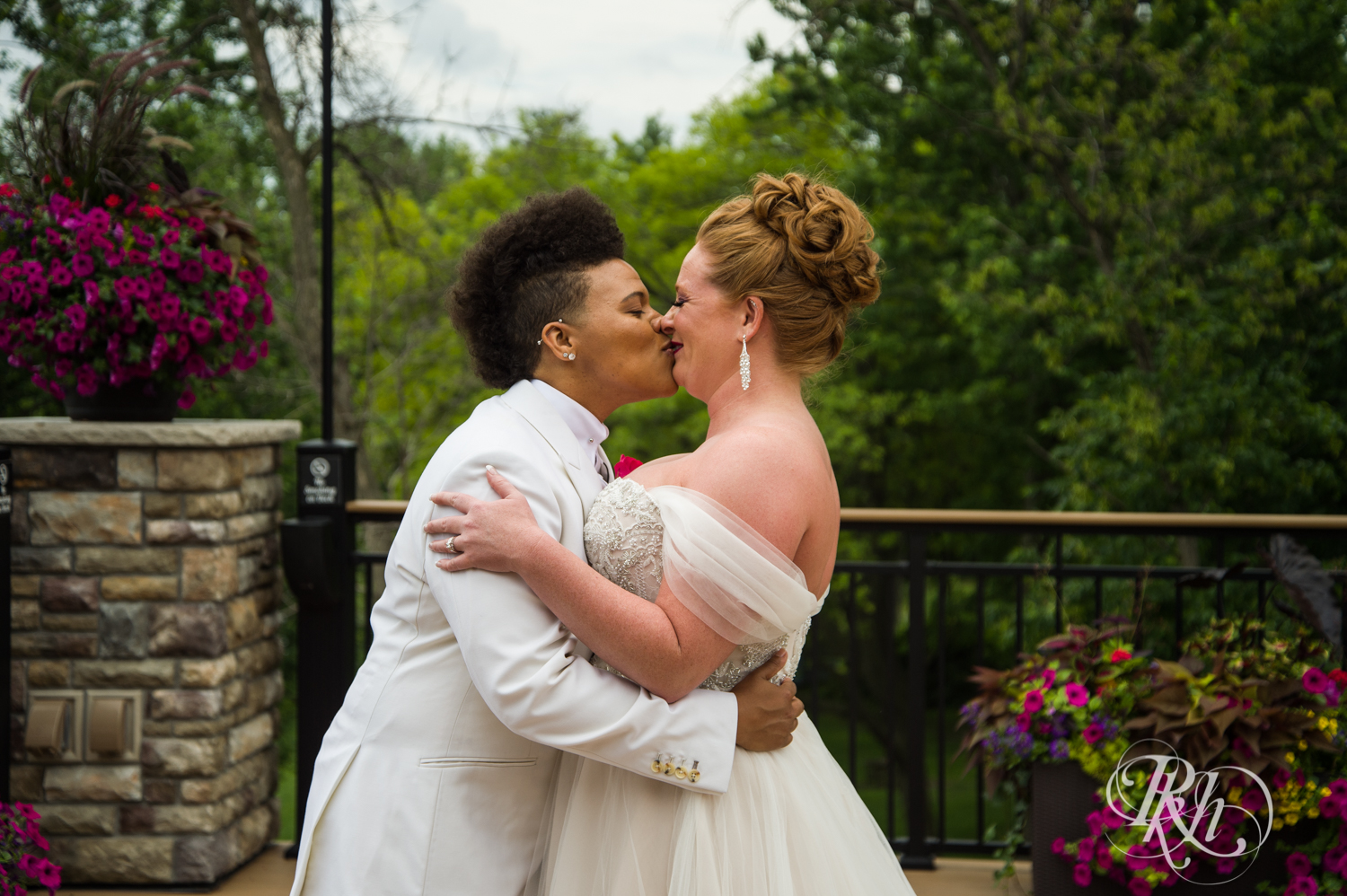 Black lesbian bride and white bride share first look at Leopold's Mississippi Gardens in Brooklyn Park, Minnesota.