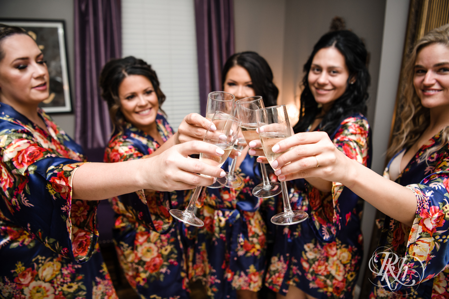 Bridesmaids toasting champagne at the Semple Mansion in Minneapolis, Minnesota.