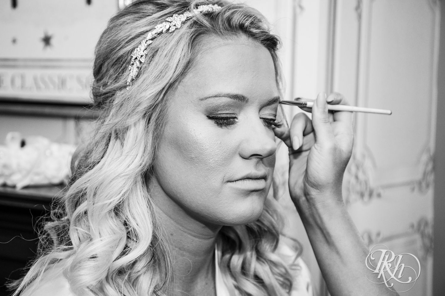 Bride getting makeup done before wedding at the Semple Mansion in Minneapolis, Minnesota.