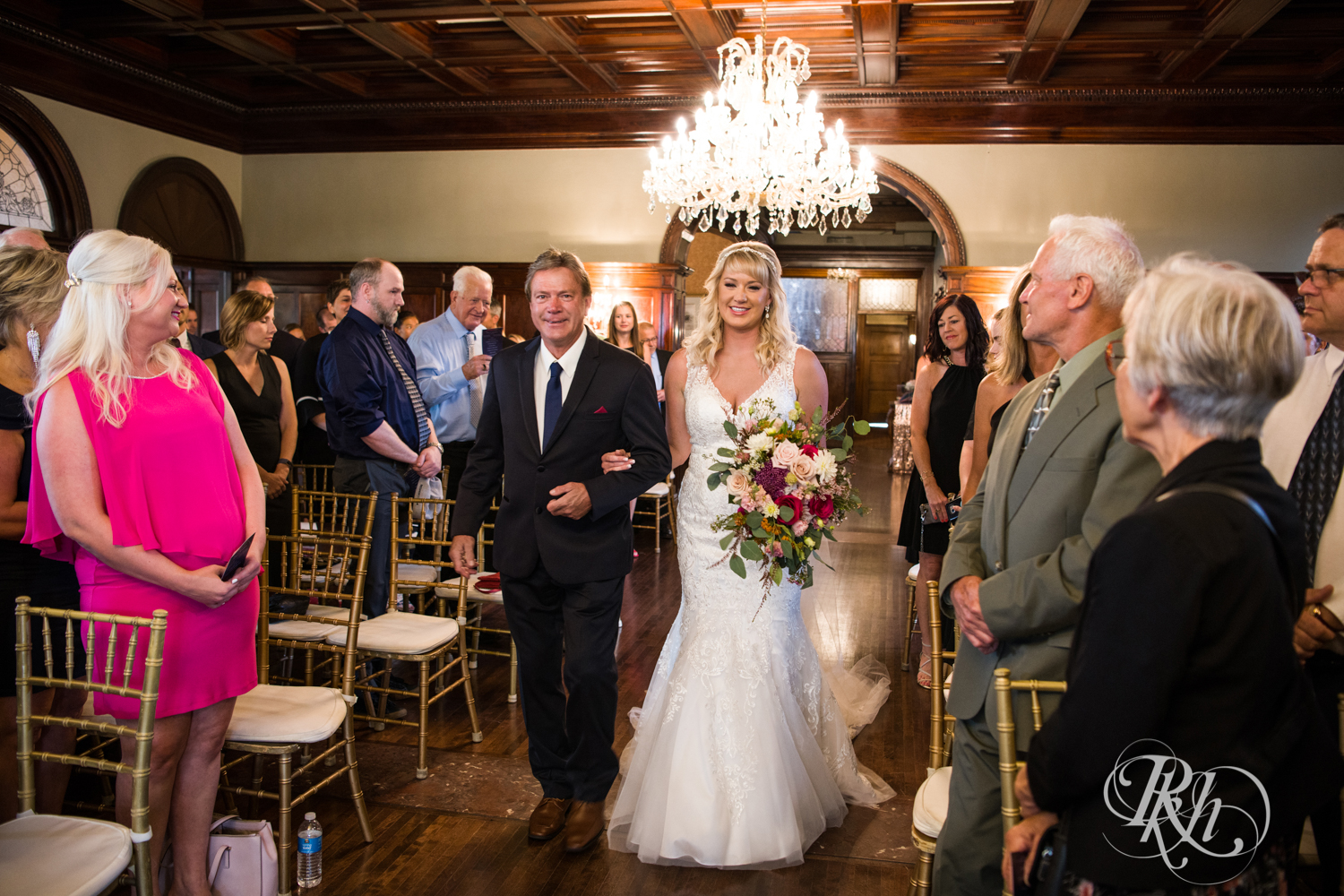Bride walks down the aisle with her dad at the Semple Mansion in Minneapolis, Minnesota.